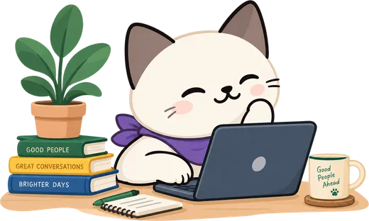 Scout at a laptop with books, a plant and a mug.